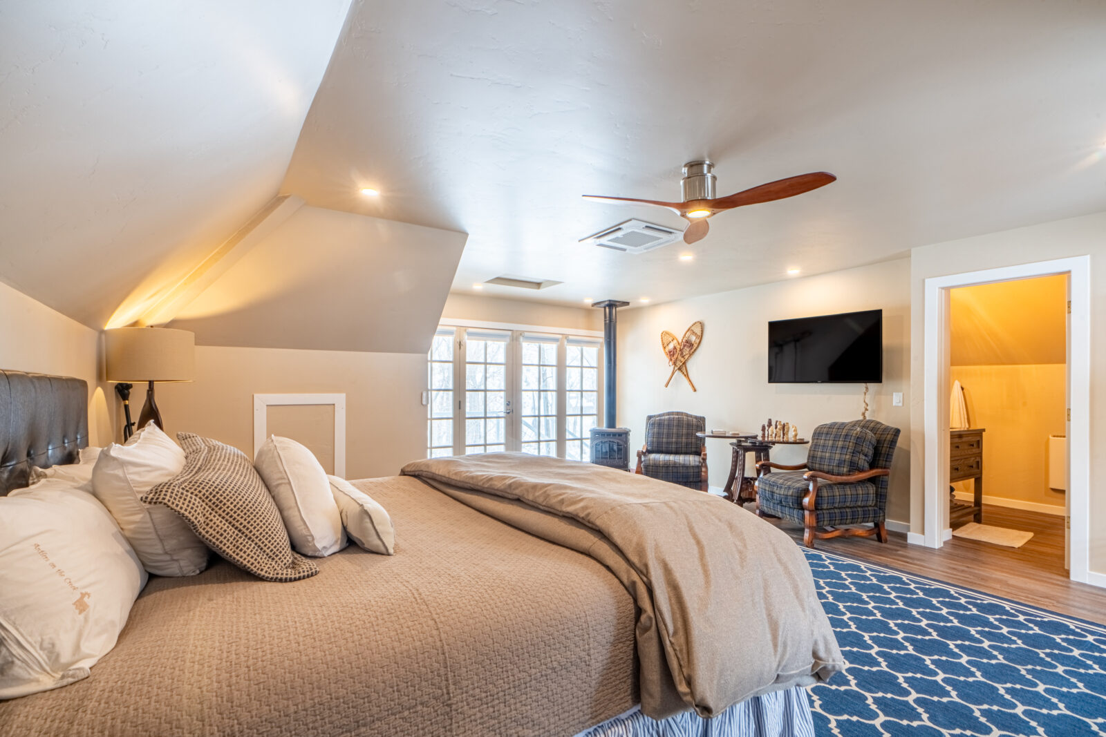 The Best Colorado Mountain Towns to Visit This Year 2 Wildcat Creek Room with king-sized bed and sitting area at our Durango Bed and Breakfast.